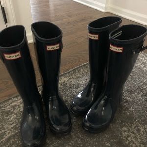 Two pairs of navy blue hunter boots